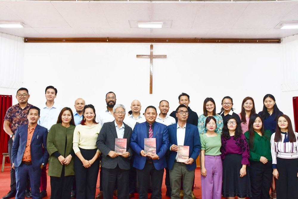 Prof L Imsutoshi Jamir, Dean of Doctoral Studies, author Dr Tinumeren Ozükum and Prof A Temjen Jamir, Principal along with Communication Master and Doctoral scholars on March 12.